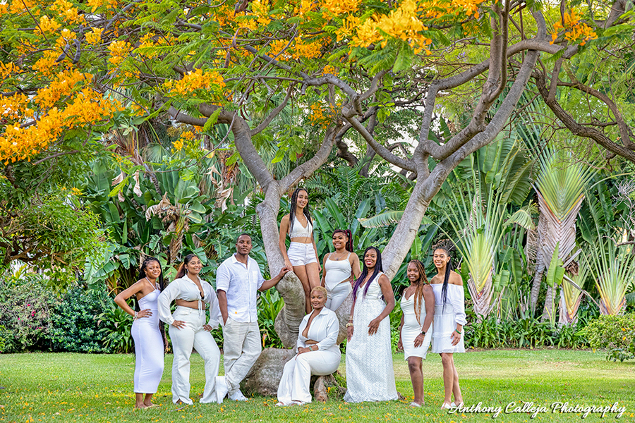 Family photo shoot clothing ideas, everyone wearing white in a garden